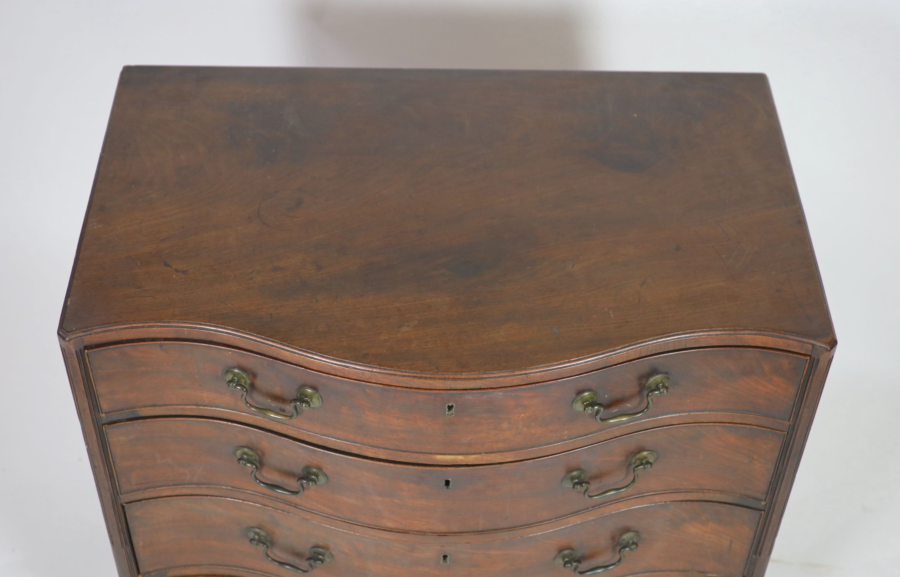 A George III mahogany caddy top serpentine chest, W 92cm D 58cm H 87cm